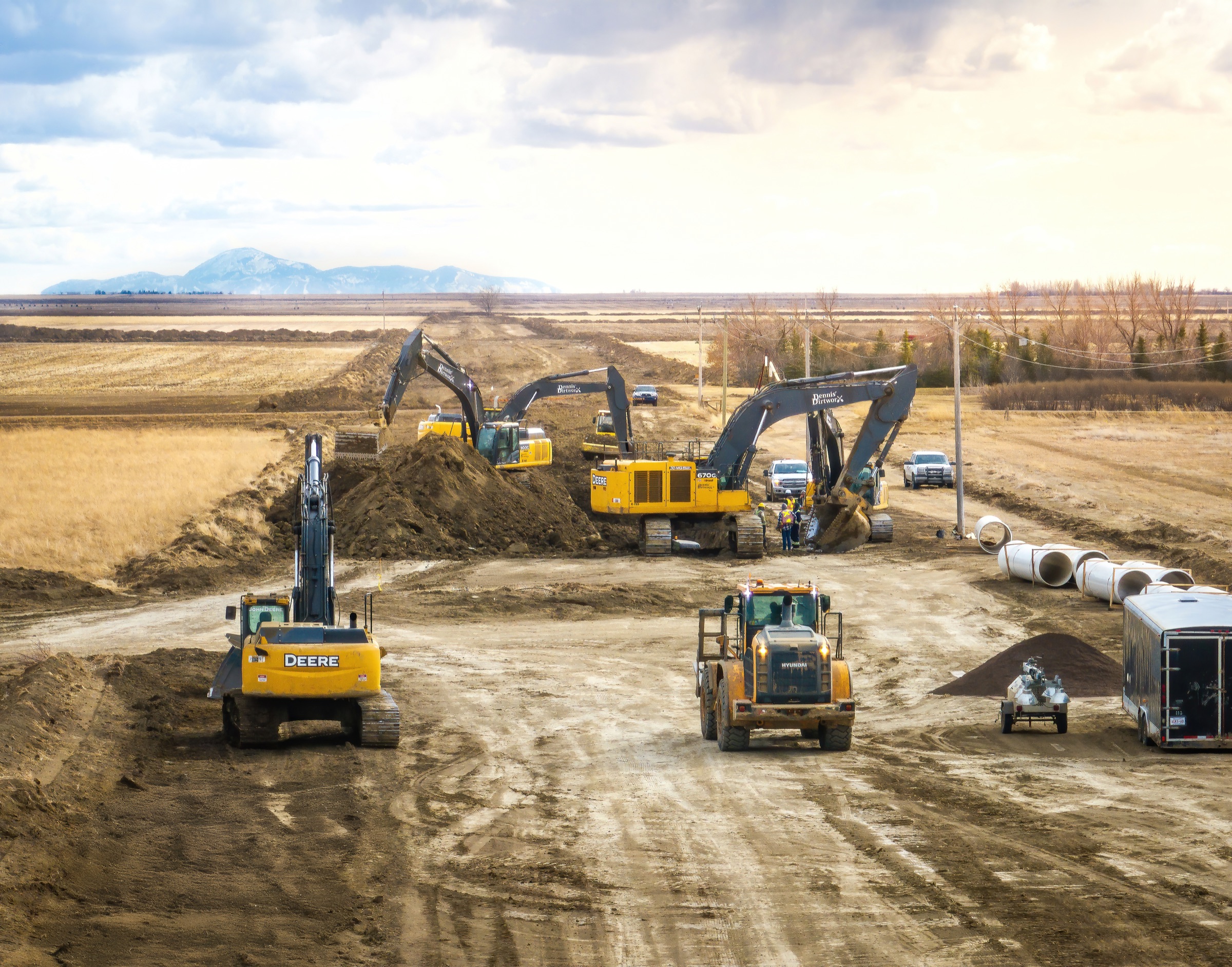 Dennis DirtWorx crews and equipment working across a large Alberta site
